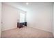 Bedroom with neutral carpet, window with blinds, and desk with chair at 2720 Dumont Ln, Tavares, FL 32778