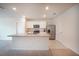 Kitchen features a center island, white cabinets, and stainless steel appliances at 2720 Dumont Ln, Tavares, FL 32778