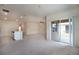 Spacious living room with sliding glass doors leading to an outdoor patio at 2720 Dumont Ln, Tavares, FL 32778
