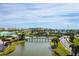 Aerial view of community; lake, bridge, and homes at 4624 Harbour Village Bv # 4205, Ponce Inlet, FL 32127