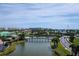 Aerial view of community; lake, bridge, and homes at 4624 Harbour Village Bv # 4205, Ponce Inlet, FL 32127