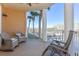 Spacious balcony overlooking marina; two wicker chairs at 4624 Harbour Village Bv # 4205, Ponce Inlet, FL 32127