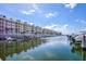 Canal view of condo building and marina with boats at 4624 Harbour Village Bv # 4205, Ponce Inlet, FL 32127