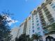 Multi-story building with balconies and white exterior at 8495 Miracle Dr # 202, Champions Gate, FL 33896