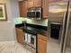 Modern kitchen with stainless steel appliances and granite countertops at 8495 Miracle Dr # 202, Champions Gate, FL 33896