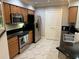 Modern kitchen with stainless steel appliances and granite countertops at 8495 Miracle Dr # 202, Champions Gate, FL 33896