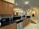 Modern kitchen with granite countertops and stainless steel appliances at 8495 Miracle Dr # 202, Champions Gate, FL 33896