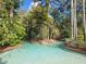 Relaxing lazy river winding through lush tropical landscaping at 8495 Miracle Dr # 202, Champions Gate, FL 33896