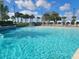 Expansive leisure pool with cabanas at 8495 Miracle Dr # 202, Champions Gate, FL 33896