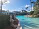 Resort-style pool with a water feature at 8495 Miracle Dr # 202, Champions Gate, FL 33896