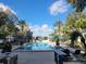 Inviting rectangular pool with blue umbrellas and lounge chairs at 8495 Miracle Dr # 202, Champions Gate, FL 33896