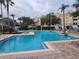 Resort-style swimming pool with lounge chairs at 8495 Miracle Dr # 202, Champions Gate, FL 33896