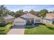 One-story home with a two-car garage and attractive landscaping at 2441 Prairie Dunes, Clermont, FL 34711