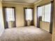 Bright bedroom with neutral walls and carpet flooring at 2441 Prairie Dunes, Clermont, FL 34711