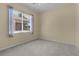 Well-lit bedroom with grey carpet and window at 2441 Prairie Dunes, Clermont, FL 34711