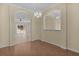 Bright dining room with hardwood floors and views into the living room at 2441 Prairie Dunes, Clermont, FL 34711