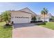 Brick paver driveway and two-car garage at 2441 Prairie Dunes, Clermont, FL 34711