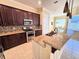 Modern kitchen with granite countertops and stainless steel appliances at 2441 Prairie Dunes, Clermont, FL 34711