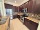 Modern kitchen featuring stainless steel appliances and granite countertops at 2441 Prairie Dunes, Clermont, FL 34711