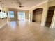 Spacious living room with tile floors and built-in shelving at 2441 Prairie Dunes, Clermont, FL 34711