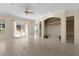 Spacious living room with tile floors and built-in shelving at 2441 Prairie Dunes, Clermont, FL 34711