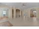 Bright living room featuring tile floors and a high ceiling at 2441 Prairie Dunes, Clermont, FL 34711