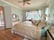 Main bedroom with king-size bed and access to backyard at 2441 Prairie Dunes, Clermont, FL 34711