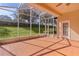 Spacious screened porch with tiled floor and backyard view at 2441 Prairie Dunes, Clermont, FL 34711