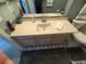 This bathroom features a modern sink and vanity, plus stylish patterned flooring at 32676 Oak Park Dr, Leesburg, FL 34748