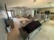 Spacious living room featuring comfortable seating, and easy access to the kitchen at 32676 Oak Park Dr, Leesburg, FL 34748