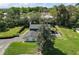 Aerial view of the property showcasing its lush landscaping and spacious layout at 1635 Hilltop Dr, Mount Dora, FL 32757