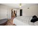 Bright bedroom with hardwood floors, white walls, ceiling fan and stylish furnishings at 1635 Hilltop Dr, Mount Dora, FL 32757