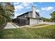 Stunning home exterior featuring a screened-in porch and beautiful landscaping at 1635 Hilltop Dr, Mount Dora, FL 32757