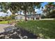 Stunning two-story home with a tree-lined yard and updated facade at 1635 Hilltop Dr, Mount Dora, FL 32757