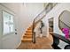 Grand foyer with brick floors, high ceilings, and curved staircase at 1635 Hilltop Dr, Mount Dora, FL 32757