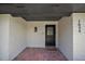 Inviting front porch with brick flooring and whitewashed walls, creating a charming entrance to the home at 1635 Hilltop Dr, Mount Dora, FL 32757