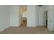 Spacious bedroom with carpet flooring and access to bathroom and closet at 2099 Keystone Pass Blvd, Minneola, FL 34715