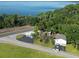 Aerial view of waterfront home with detached building and large lot at 1501 N Cr 19A, Eustis, FL 32726