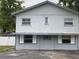 The exterior of the two-story building features an awning and a unique window design at 1501 N Cr 19A, Eustis, FL 32726