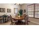 Cozy dining area with hardwood table and decorative chairs with a natural light at 23321 N Buckhill Rd, Howey In The Hills, FL 34737