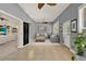 Spacious living room featuring neutral paint, tile flooring, with bright natural light at 23321 N Buckhill Rd, Howey In The Hills, FL 34737