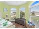 Arched windows in a bedroom providing natural light and neighborhood views at 1786 Red Clover Ln, The Villages, FL 32163