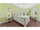 Relaxing bedroom with tropical decor, tray ceiling, and large windows offering bright natural light at 1786 Red Clover Ln, The Villages, FL 32163