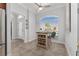 Bright breakfast nook with views of the front yard and stylish decor at 1786 Red Clover Ln, The Villages, FL 32163