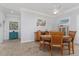 Well-lit dining area with decor and views of the open floor plan at 1786 Red Clover Ln, The Villages, FL 32163