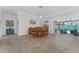 Open dining area with views of the outdoor lanai and private pool at 1786 Red Clover Ln, The Villages, FL 32163