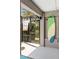 Exterior view with a surfboard near the pool area with speakers and patio access at 1786 Red Clover Ln, The Villages, FL 32163