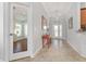 Open foyer featuring tile flooring and natural light at 1786 Red Clover Ln, The Villages, FL 32163