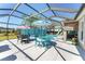 Relaxing pool and patio area with screened enclosure and multiple seating areas at 1786 Red Clover Ln, The Villages, FL 32163