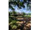 Secluded brick home and outbuilding nestled amongst mature trees, providing privacy and lots of space at 1921 Smitty Rd, Lady Lake, FL 32159
